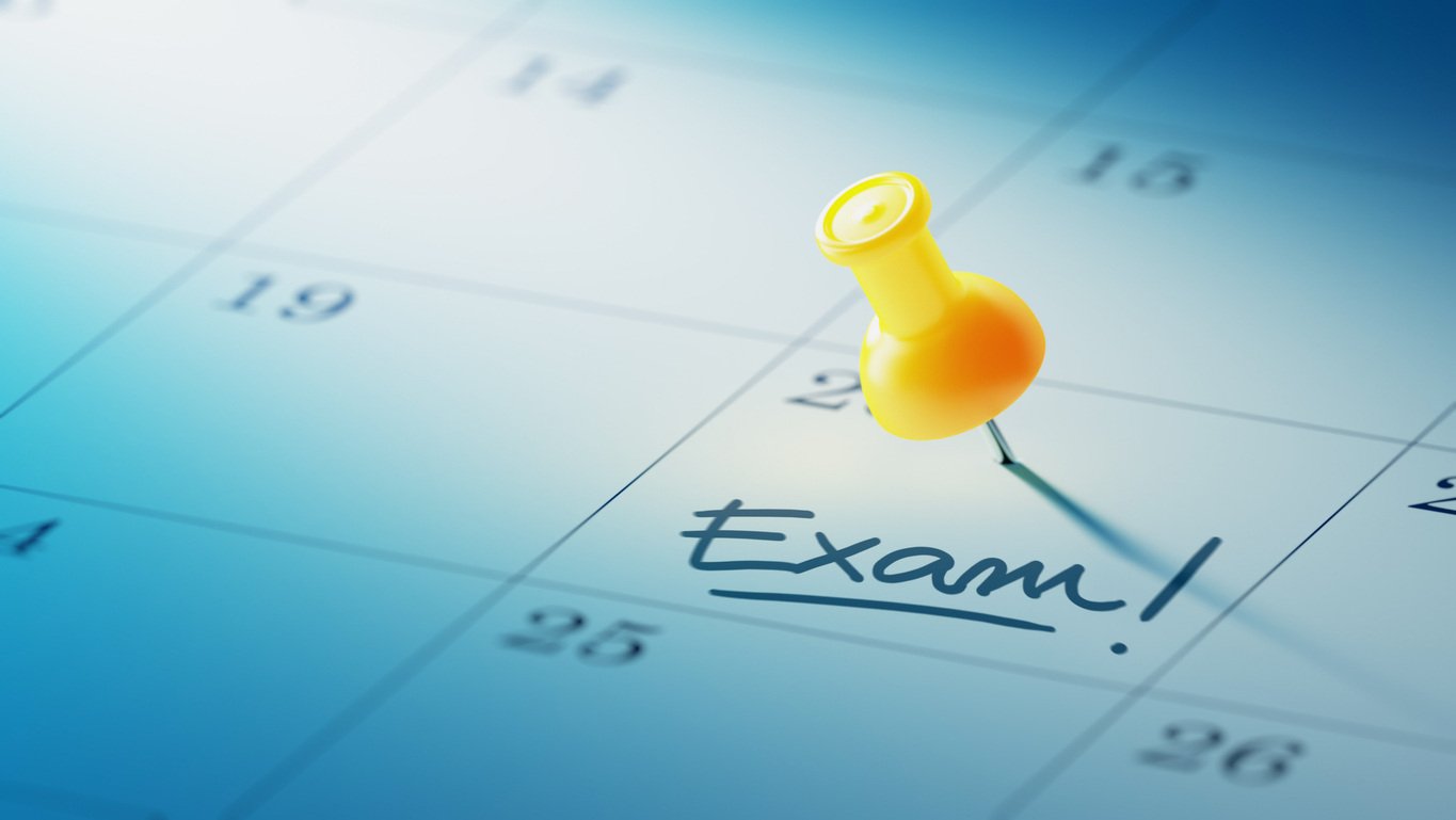 Calendar with exam writing and yellow pin